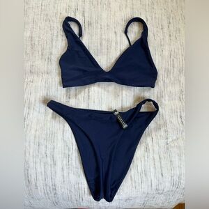 Ark bikini, never worn. Bottom medium, top small.
